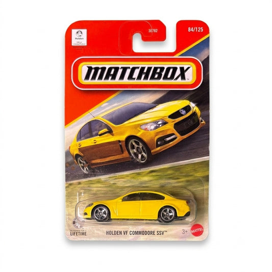 Matchbox Holden VF Commodore SSV in yellow, Basics 1:64 die-cast sedan on sealed blister card #84